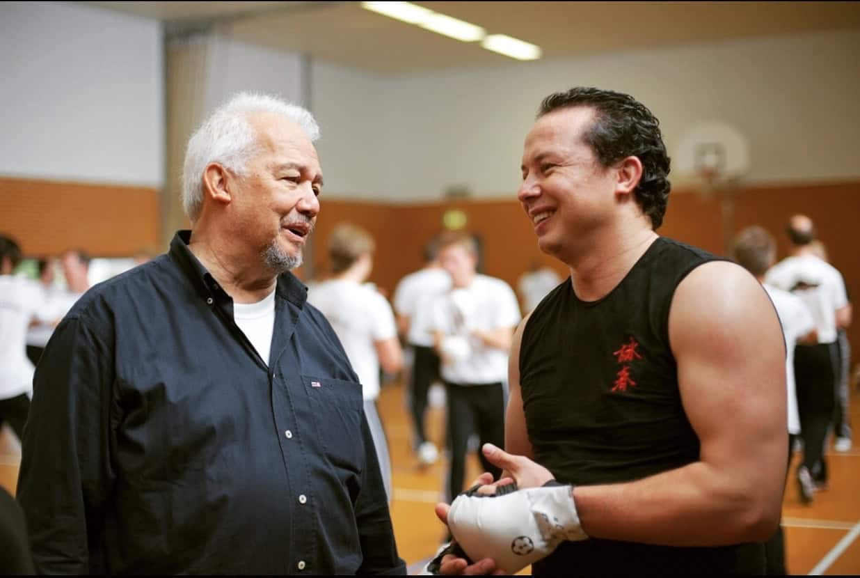 Dedicated Wing Chun Kung Fu instructors and students sharing knowledge in training session.